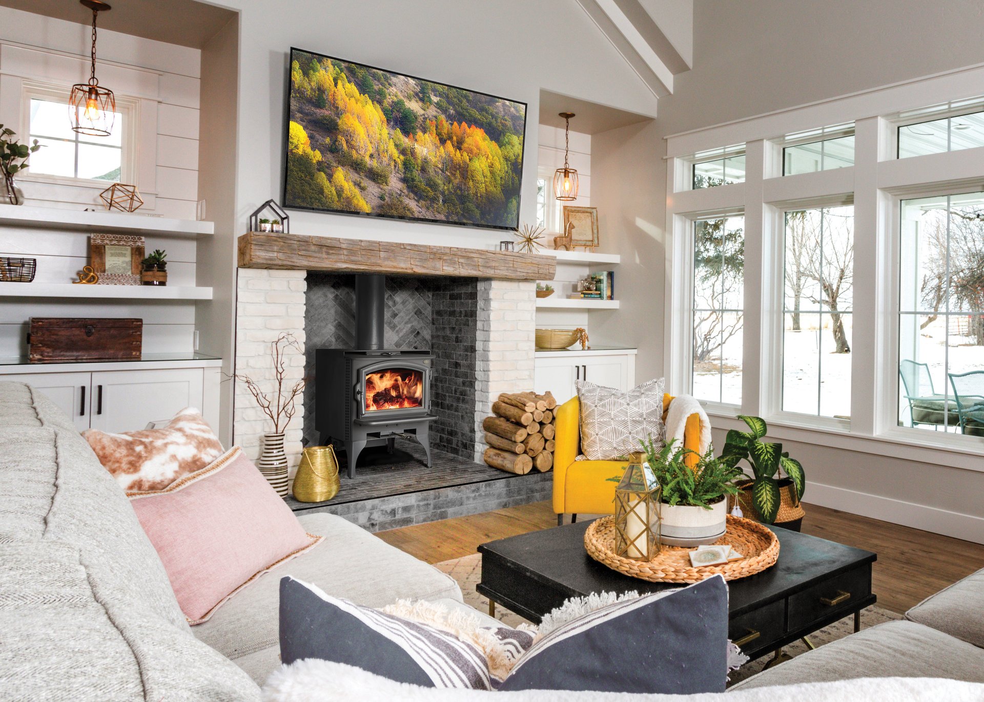 Lopi wood stove on brick hearth in bright modern family room
